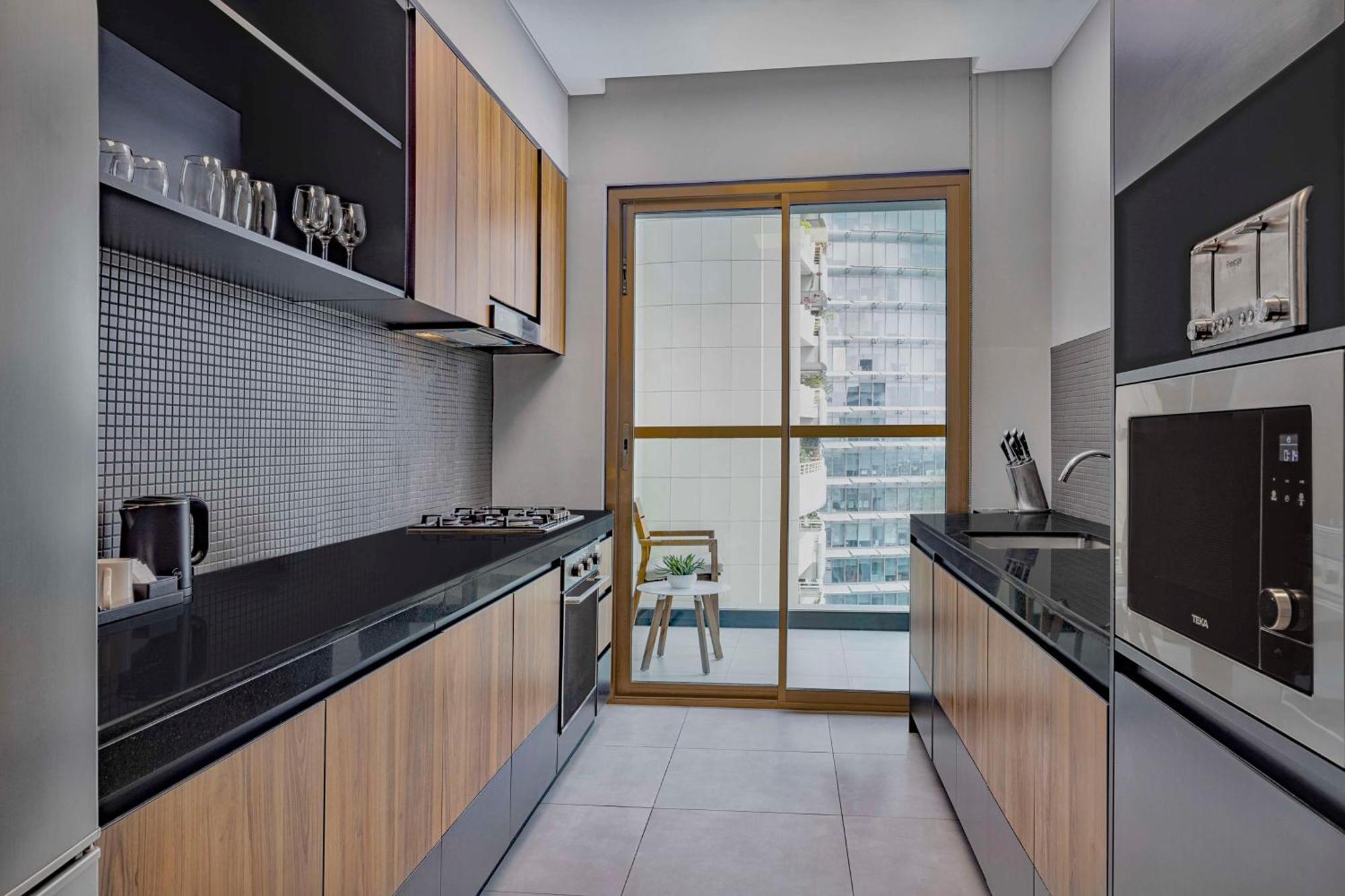 Doubletree By Hilton Dubai M Square Hotel & Residences Exterior photo A modern kitchen