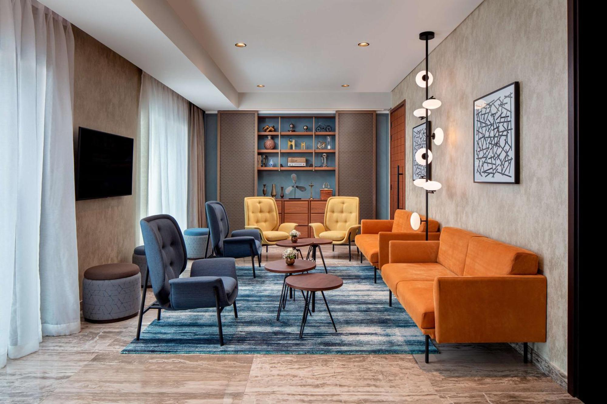 Doubletree By Hilton Dubai M Square Hotel & Residences Exterior photo The lounge at the hotel