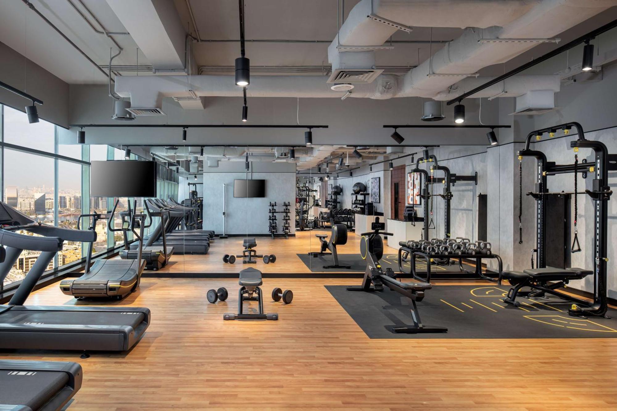 Doubletree By Hilton Dubai M Square Hotel & Residences Exterior photo The gym at the hotel