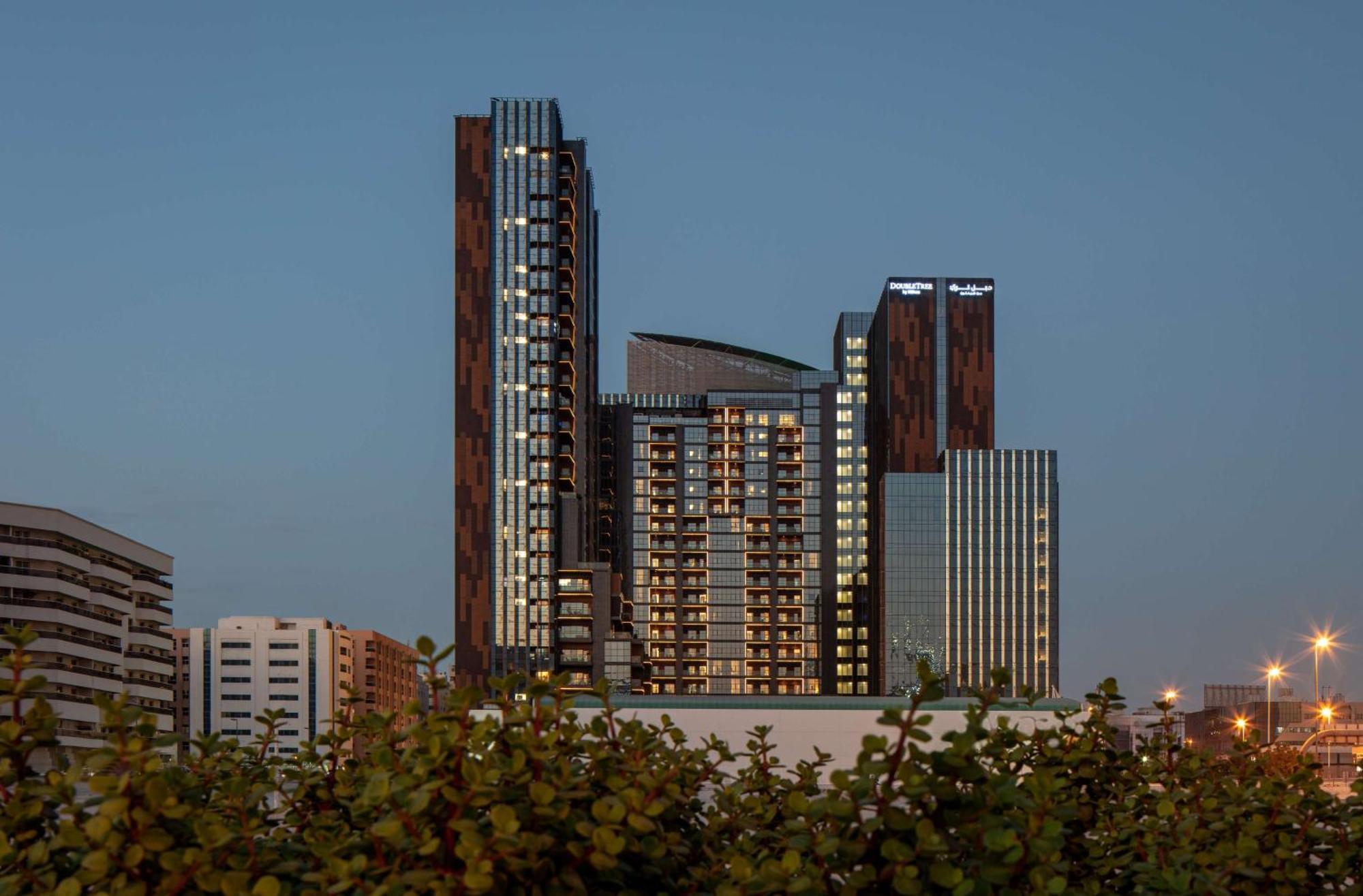 Doubletree By Hilton Dubai M Square Hotel & Residences Exterior photo The building at night