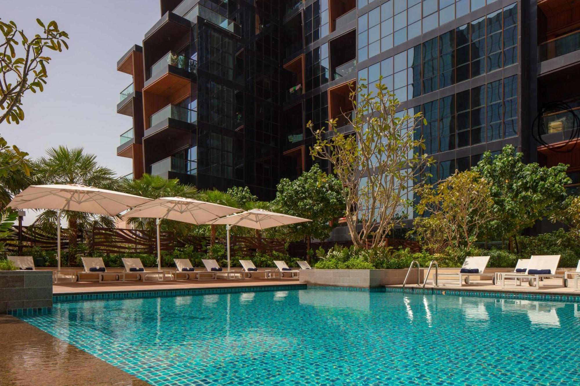 Doubletree By Hilton Dubai M Square Hotel & Residences Exterior photo The Panorama Pool