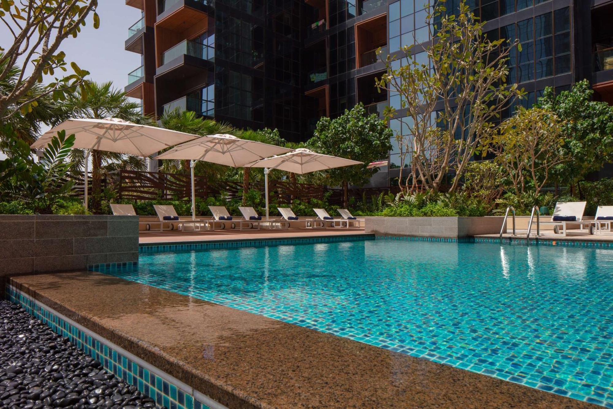 Doubletree By Hilton Dubai M Square Hotel & Residences Exterior photo The Park's swimming pool